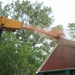 Close-up of wood chipper throwing debris into the Arborcare garbage truck